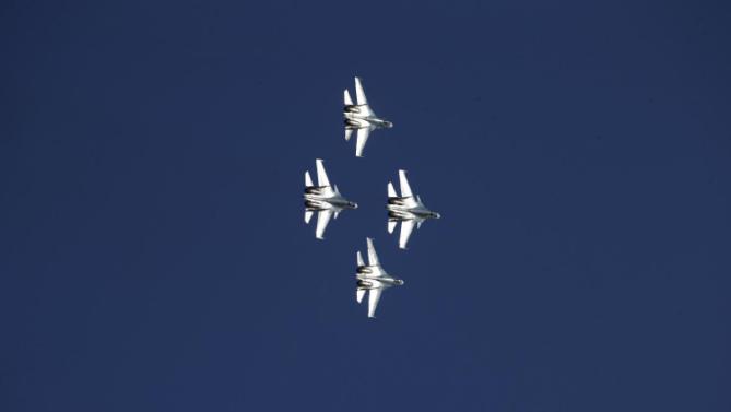 Russian Sukhoi jets fly during the Army-2015 show at a shooting range in Alabino, outside of Moscow, Russia, on Tuesday, June 16, 2015. Russia��s military this year alone will receive over 40 new intercontinental ballistic missiles capable of piercing any missile defences, President Vladimir Putin said Tuesday in a blunt reminder of the nation��s nuclear might amid tensions with the West over Ukraine. (AP Photo/Ivan Sekretarev)